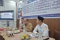 Pj Bupati Langkat dalam kegiatan sosialosasi yang digelar Bawaslu Langkat di Caffe Warisan Stabat.