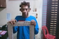 Mukti Ali, pelempar kaca jendela rumah Ramlan di Mapolsek Tangjung Pura.