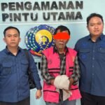 Tersangka TP Ketua KONI Langkat periode 2021-2023 usai menjalani Tahap II di Kejari Langkat