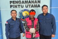 Tersangka TP Ketua KONI Langkat periode 2021-2023 usai menjalani Tahap II di Kejari Langkat.