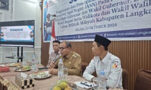 Pj Bupati Langkat dalam kegiatan sosialosasi yang digelar Bawaslu Langkat di Caffe Warisan Stabat