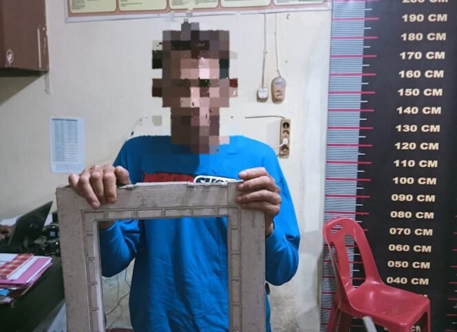 
Mukti Ali, pelempar kaca jendela rumah Ramlan di Mapolsek Tangjung Pura.